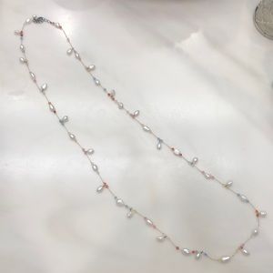 Natural pearls in a 40 inch necklace with colored beads.